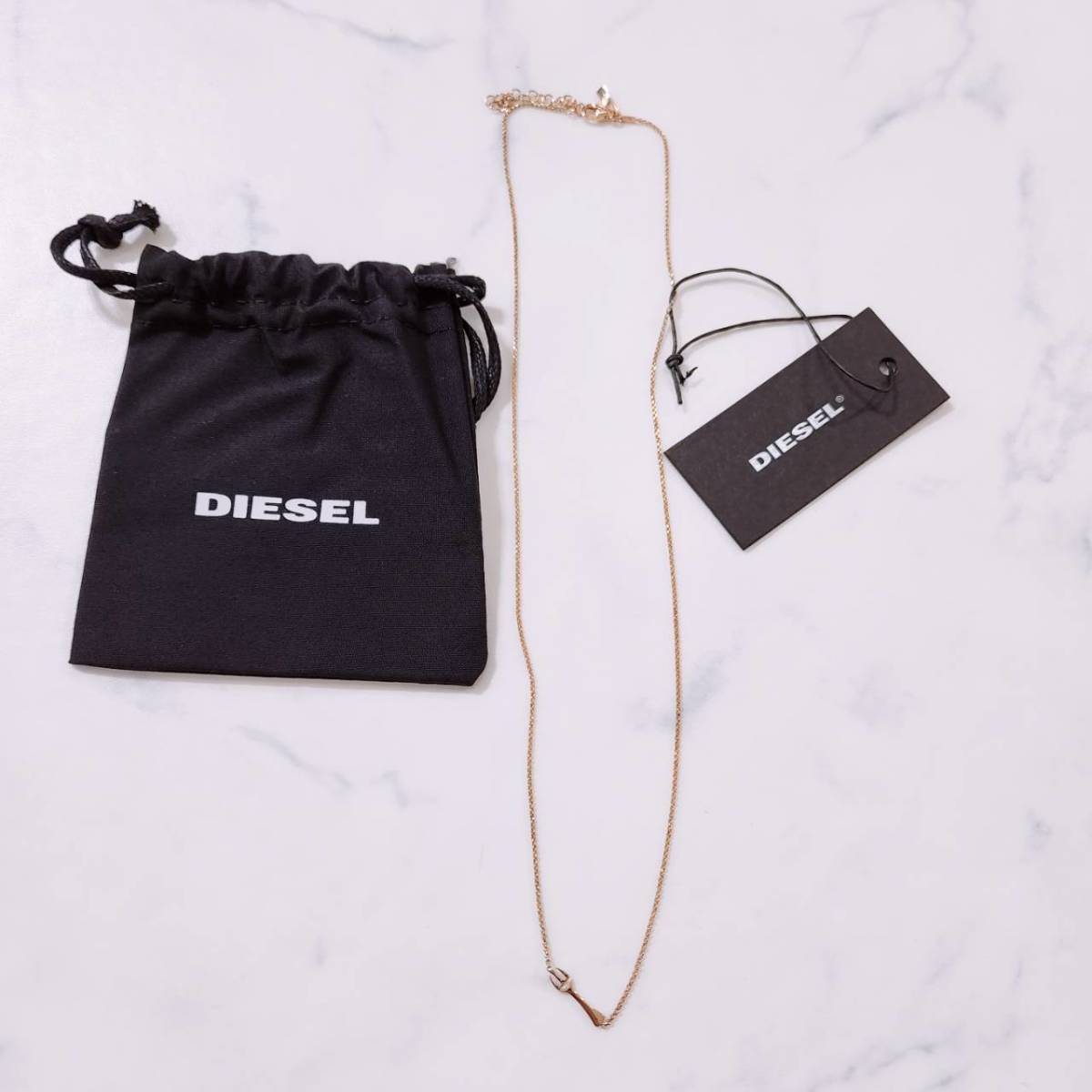 新古品 レディース DIESEL ネックレス ペンダント ゴールド 金色 フォーク 可愛い 高級 タグ付き 未使用 袋付き キレイ ディーゼル 【23289】